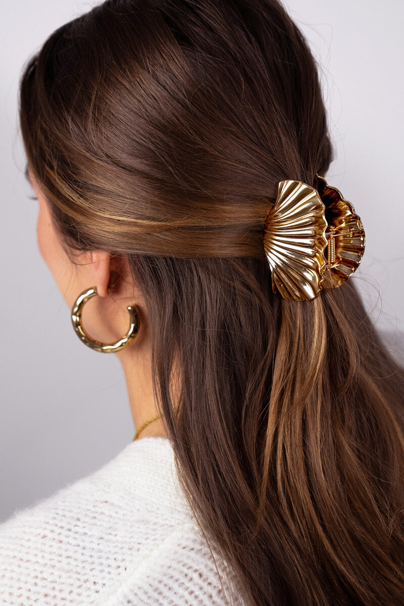 Gold coloured hair clip shell