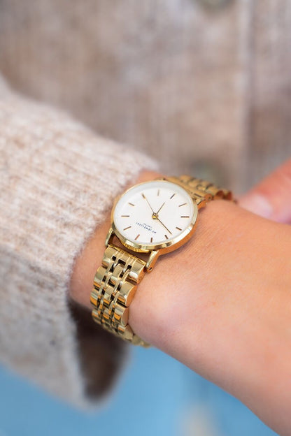 Chain strap watch with white round watch face